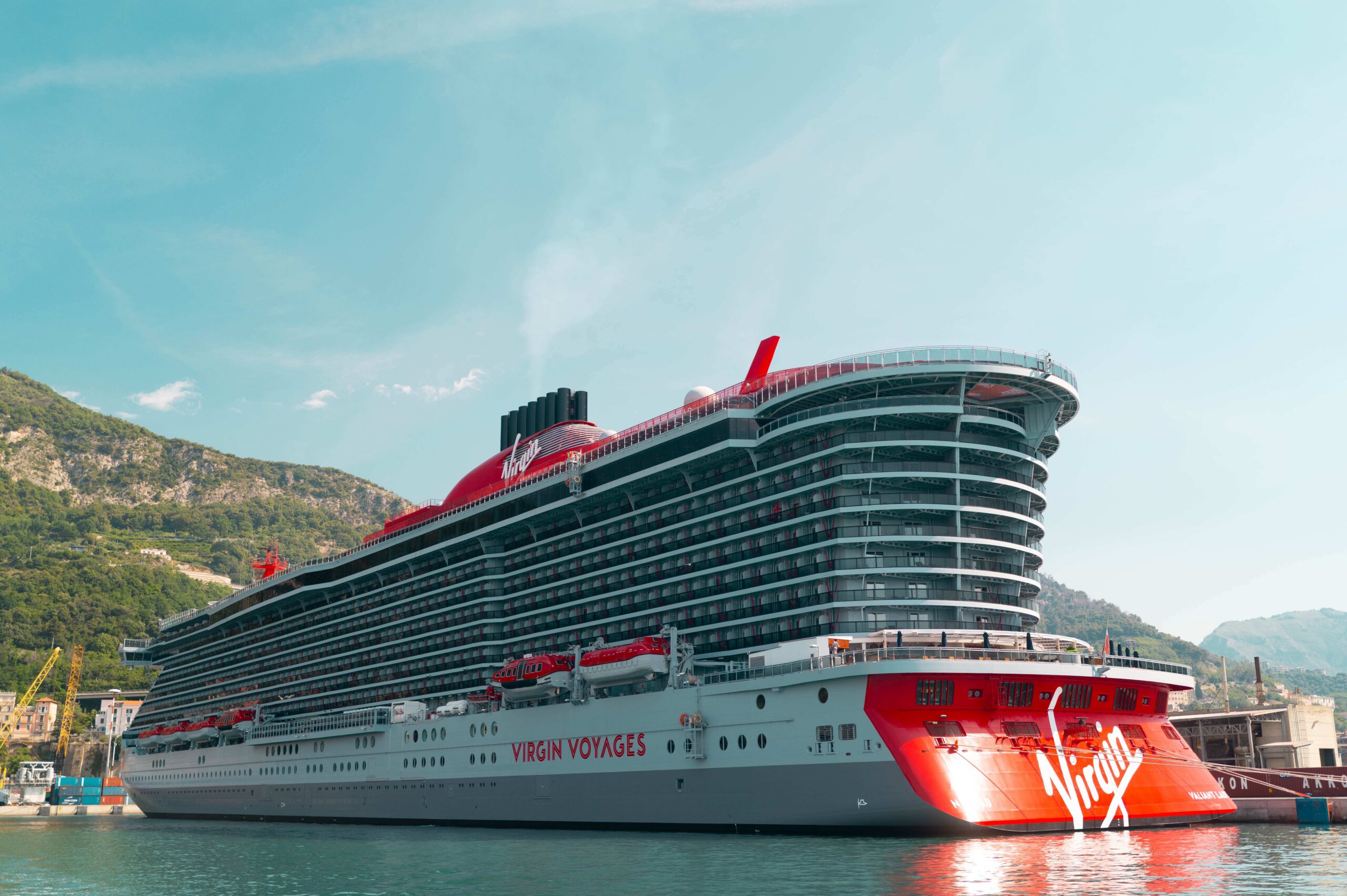 Virgin Voyages cruise ship sailing the Amalfi Coast in Italy on a Mediterranean cruise